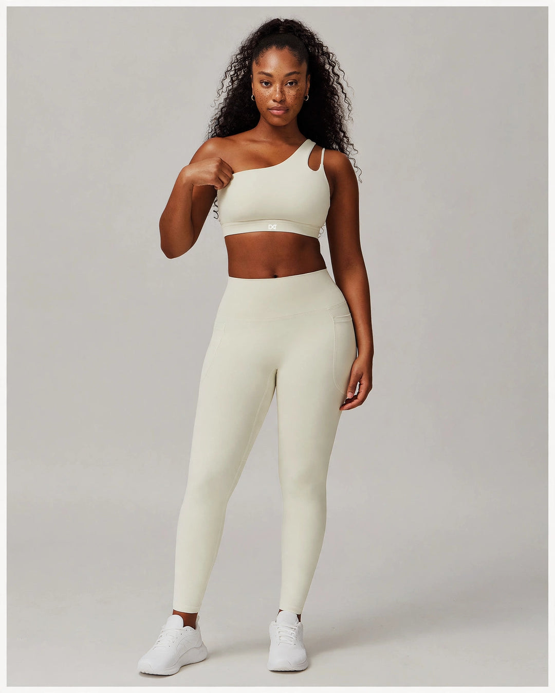 The Frame One Shoulder Bra Cream on model - front view